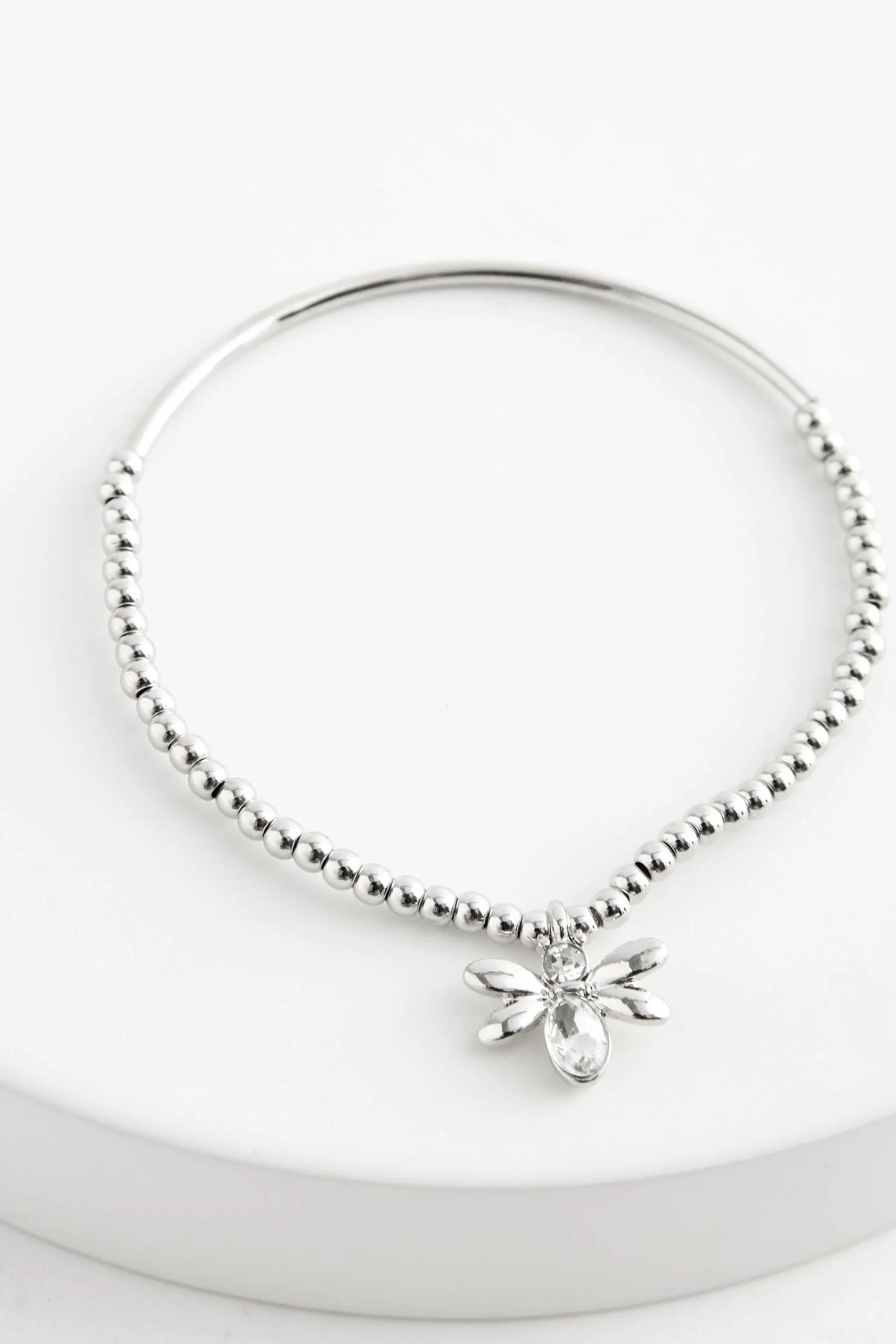 Colore argento  - Bracciale elasticizzato con perline e ciondolo ape