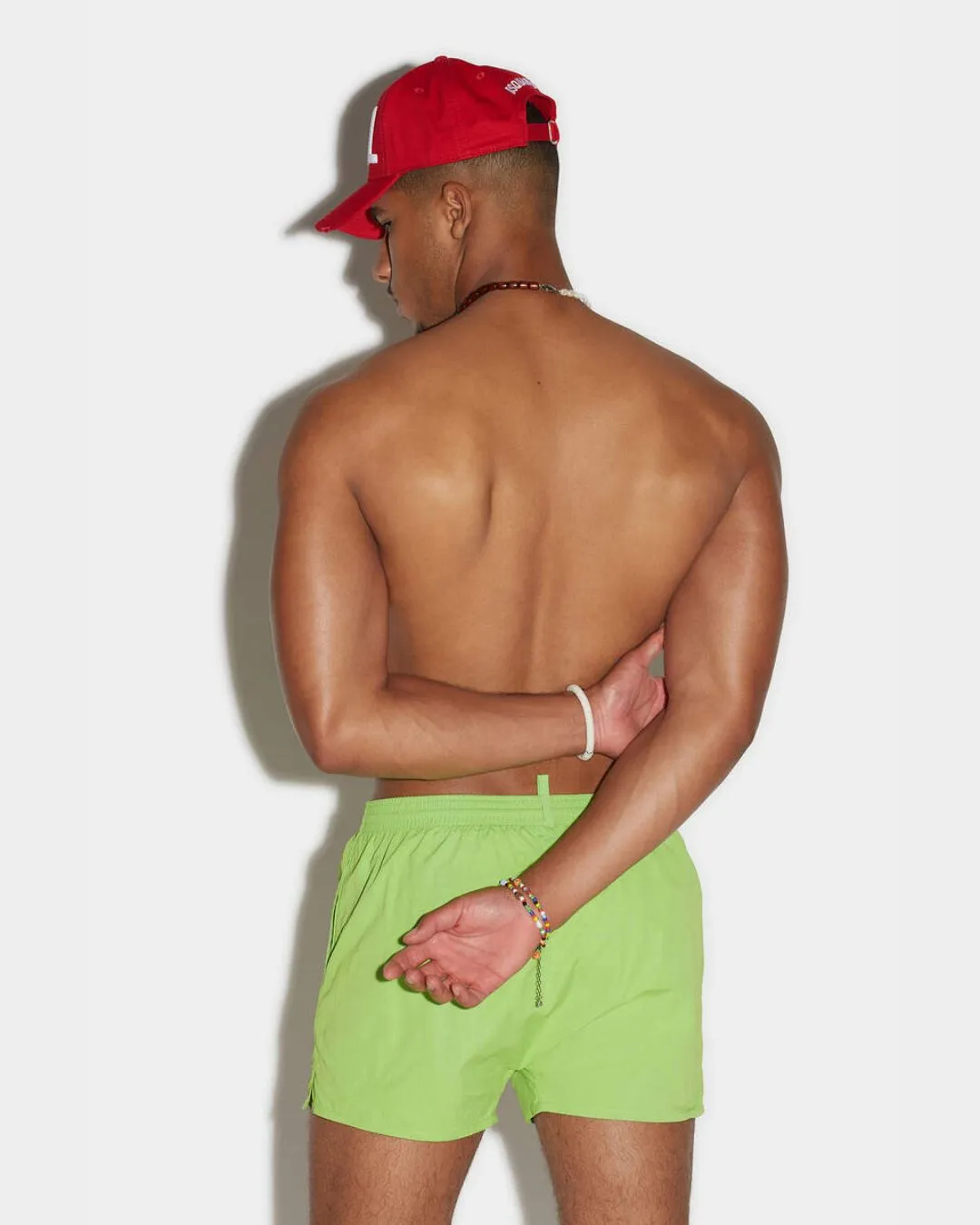 COSTUME VERDE CON SCRITTA ARANCIO