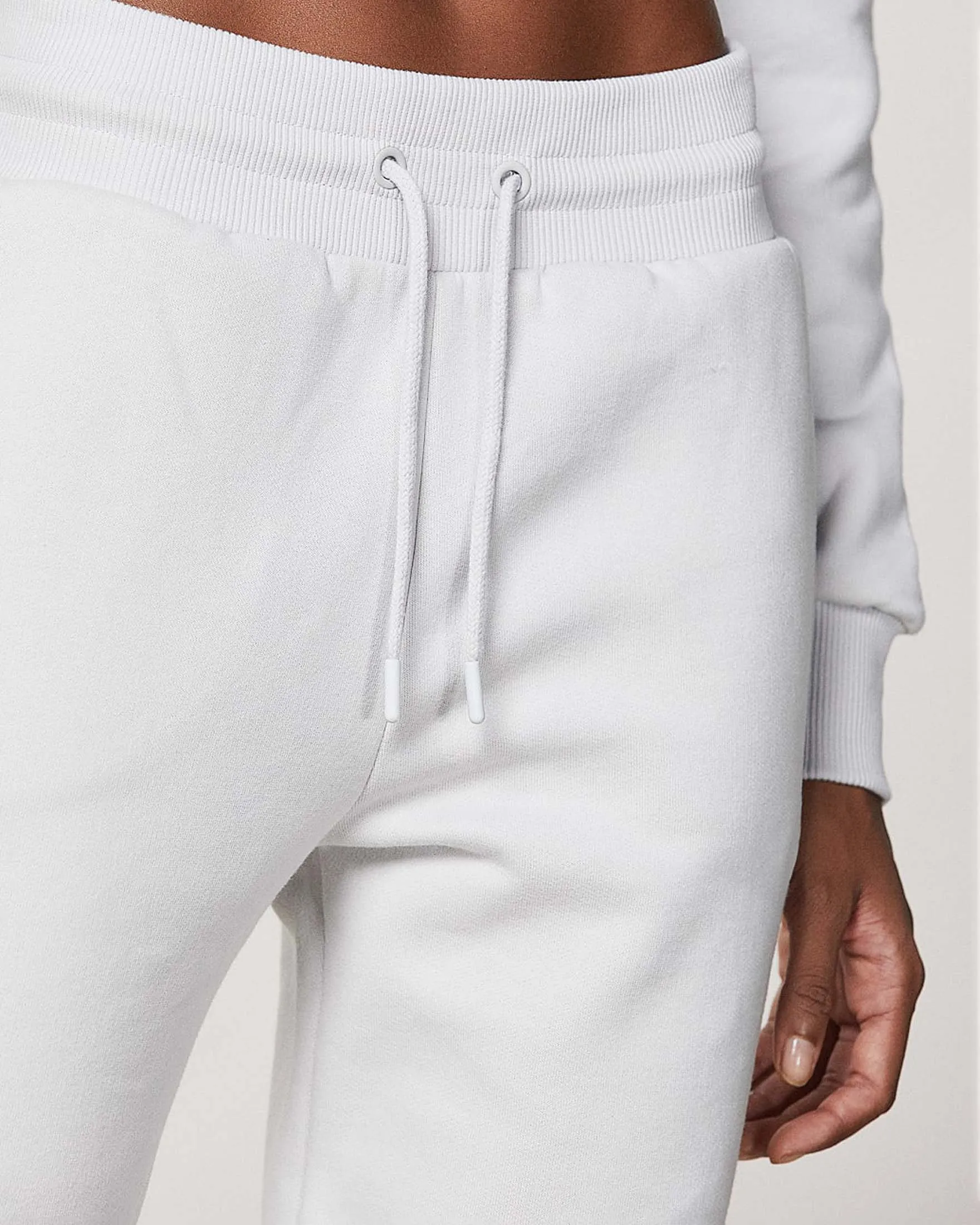 Joggers color ghiacchio in felpa di cotone con polsini al fondo e  coulisse in vita