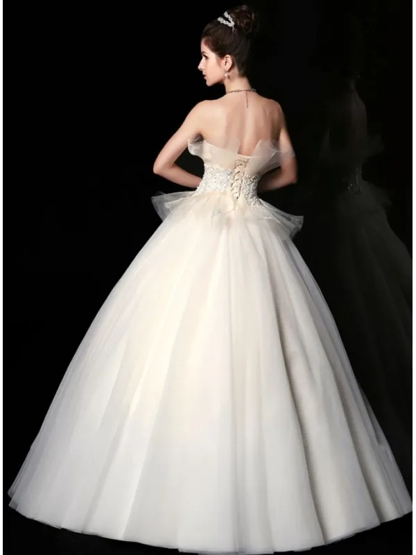 Vestito da Sposa principesco con gonna semplice in tulle e corpetto lavorato